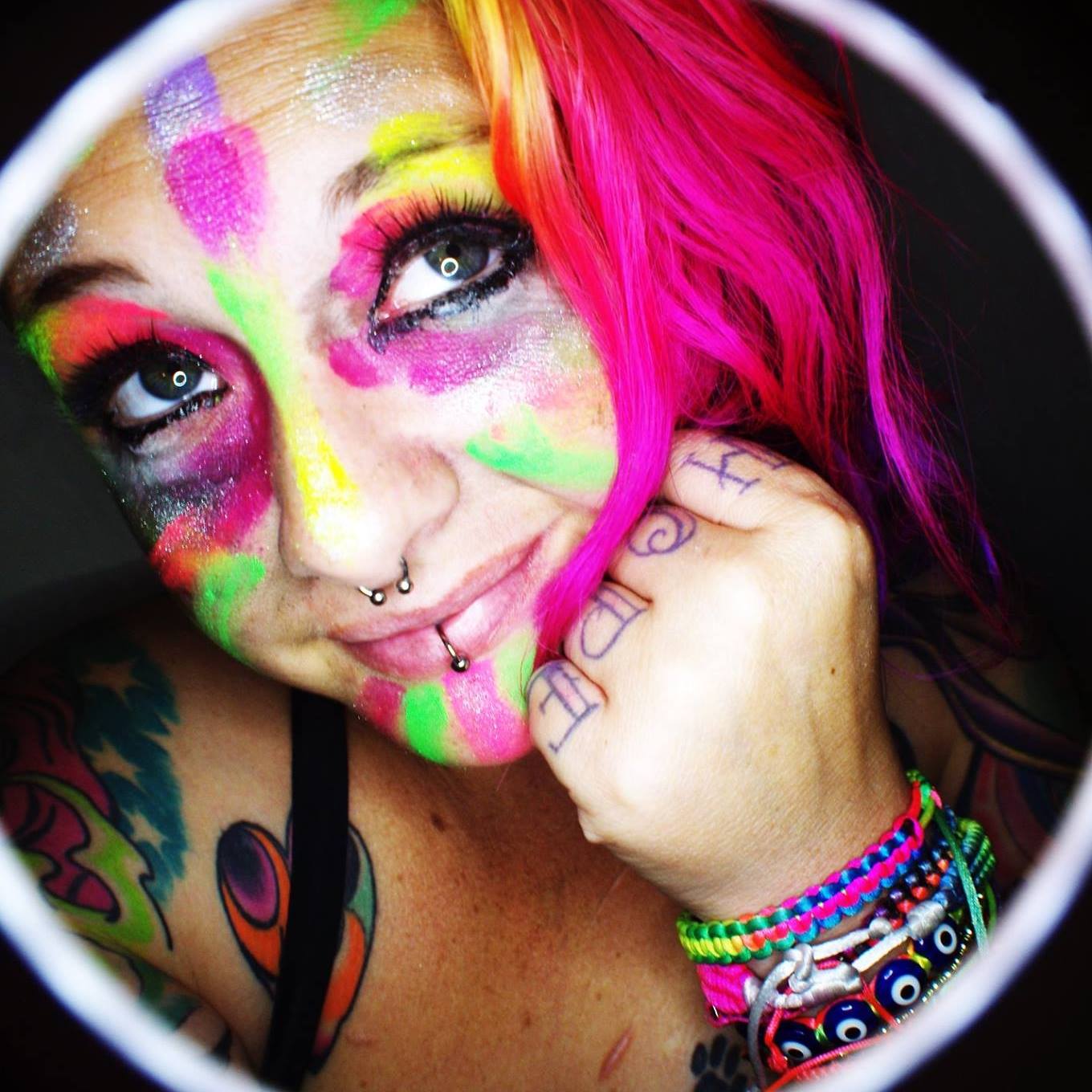 Mahlie Jewell wearing all the colours of the rainbow on her face and in her hair